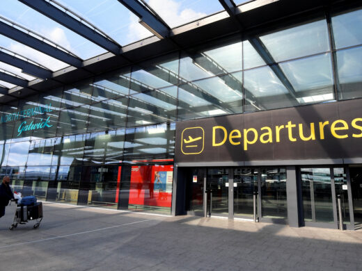 FILE PHOTO: A passenger arrives at Gatwick Airport, in Gatwick